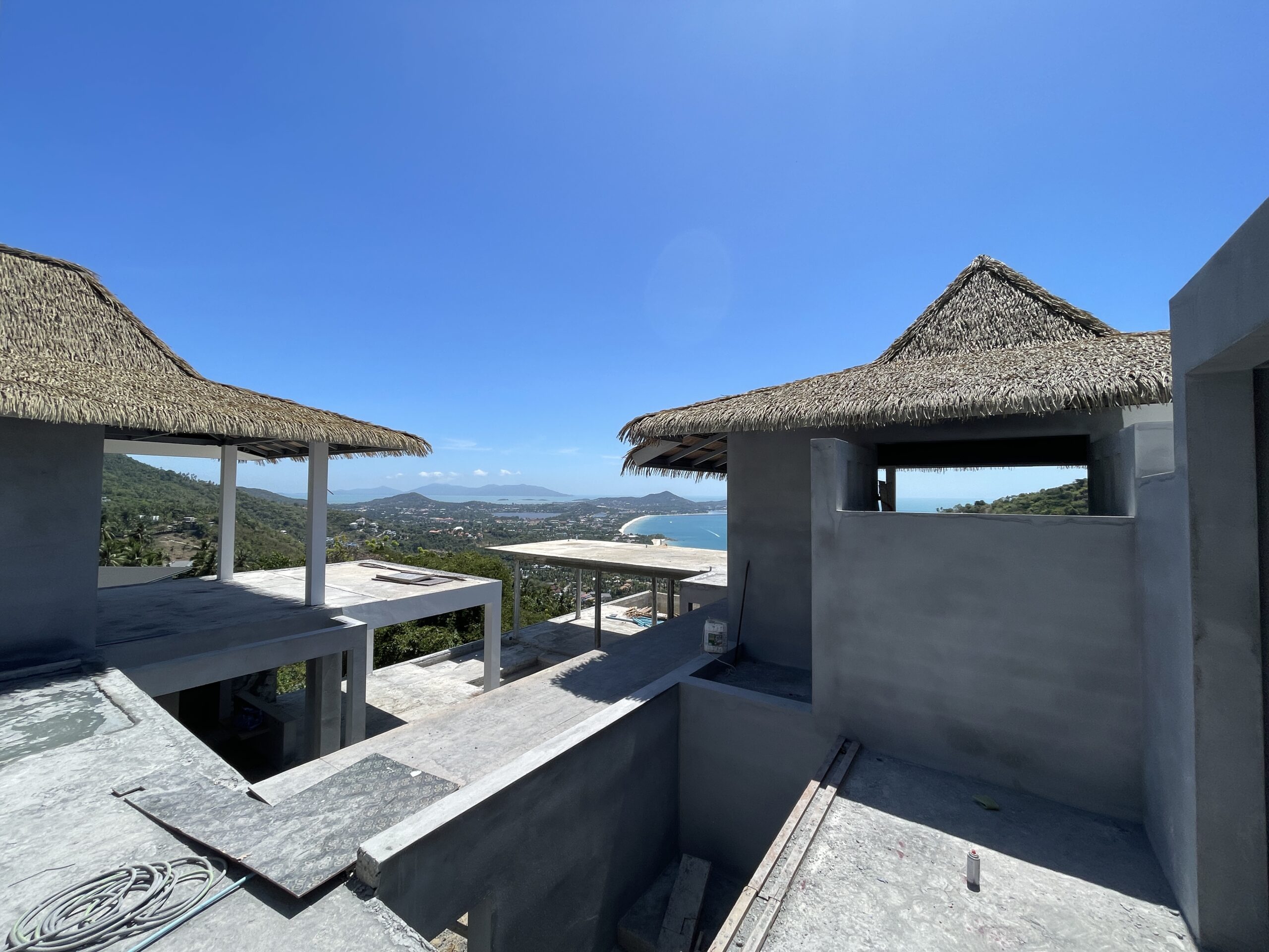 Twin thatched pavilions and the bay – Villa Dream, Koh Samui